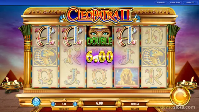 A fully rendered screenshot of the Cleopatra II slot game showing a 5-reel, 3-row grid with an active win message of 6.00 displayed over the center reel.
