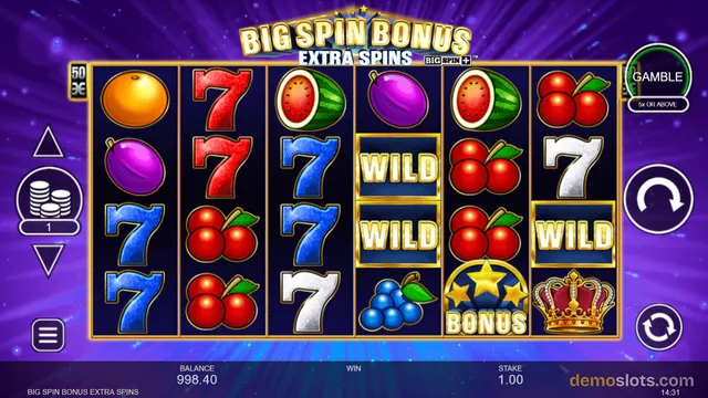 A slot game titled Big Spin Bonus Extra Spins shows a 6-reel grid filled with fruit and seven symbols, with a balance of 998.40 and a stake of 1.00.