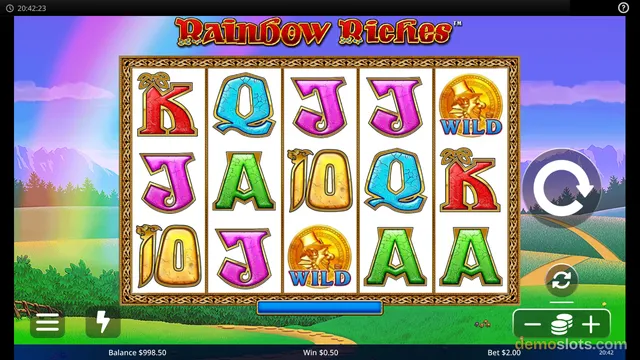 A 5-reel, 3-row slot machine game titled Rainbow Riches displays a settled grid of letter symbols and wilds against a background of a green field with a rainbow and purple sky.