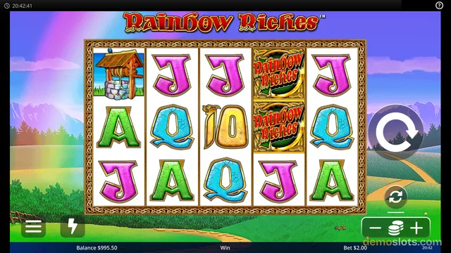 A 5x3 grid of slot reels displaying cracked letter symbols, a well, and stacked Rainbow Riches logo symbols against a bright rainbow background.