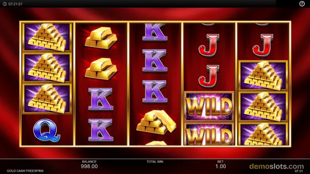 A slot game grid showing gold bars, pyramids, and letter symbols with a red background.
