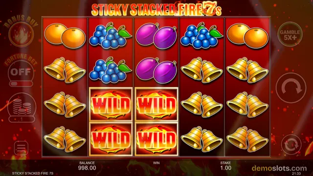 A 5x4 video slot game titled 'Sticky Stacked Fire 7s' displaying a grid of fruit, bell, and wild symbols on a red background.