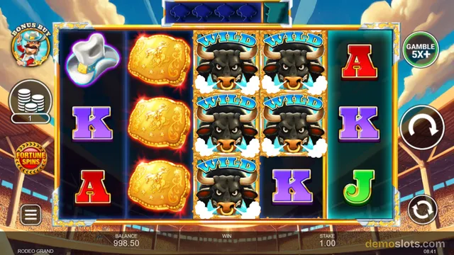 Rodeo Grand slot game showing a 5x3 reel grid with a cowboy hat, gold plaques, bull wilds, and letter symbols, with a balance of 998.50 and stake 1.00