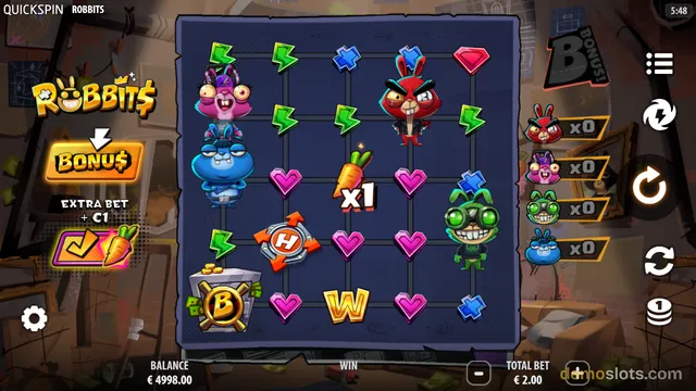 A screenshot of the Robbits slot game showing a 5x5 grid of cartoon rabbit characters and other symbols on a dark blue background with a workshop-themed border.