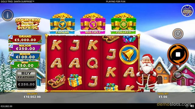 A snowy Christmas-themed slot game shows a red 5x3 reel grid with festive symbols and a Santa Claus character standing to the right.