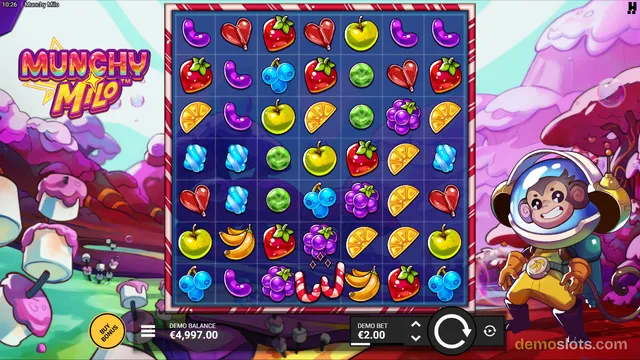 A 6x6 slot grid filled with colorful fruit symbols, set against a candy-themed background with a cartoon monkey astronaut character beside the reels.