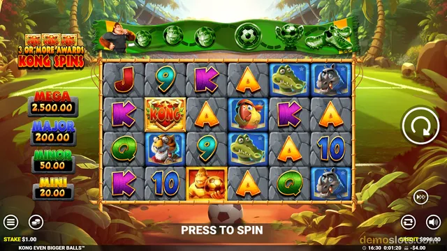 A screenshot of the slot game Kong Even Bigger Balls displaying a 6x4 grid of symbols over a jungle and soccer field background.