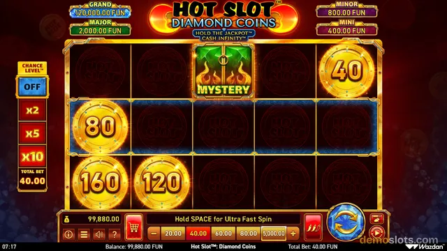A screenshot of the Hot Slot: Diamond Coins video slot showing a 5x3 grid with glowing coin symbols and a mystery box.