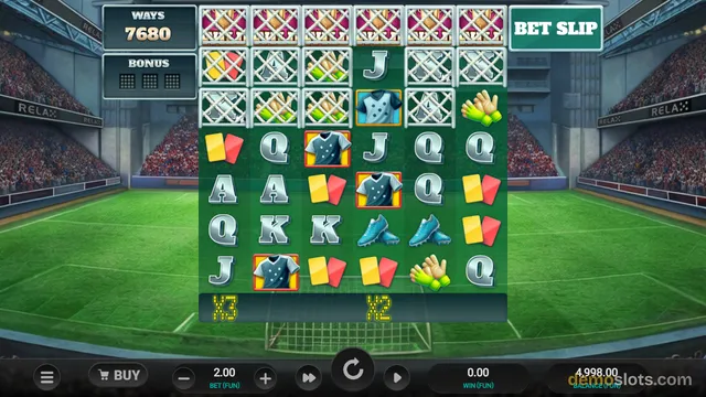 A 6x5 video slot game screen with a football stadium background, showing a settled grid of symbols including football kits, cleats, gloves, cards, and letter tiles.