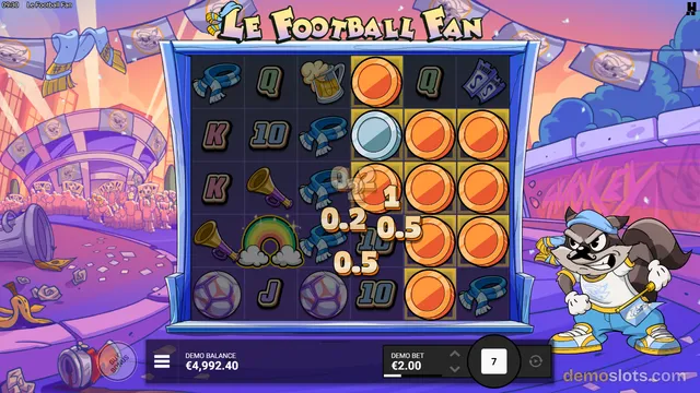 A brightly rendered slot game screen titled Le Football Fan showing a 5x5 grid with cartoon football fan symbols, win values, and a raccoon mascot.