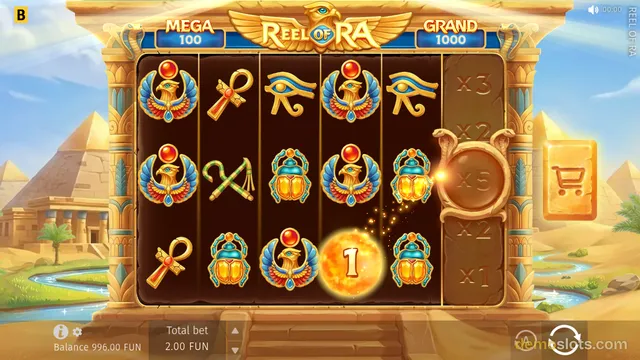A settled 5x3 Egyptian-themed slot game titled Reel of Ra shows a fully rendered reel grid with symbols like winged sun deities, ankhs, and scarab beetles, with a glowing multiplier orb in the bottom row.
