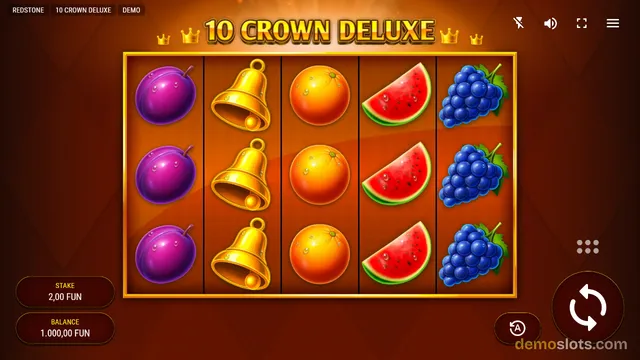 A screenshot of the 10 Crown Deluxe slot machine showing a 5x3 grid of fruit and bell symbols on a dark red background.
