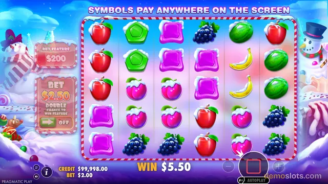 A fully rendered winter-themed slot game grid showing a settled combination of candy and fruit symbols with a $5.50 win displayed at the bottom.