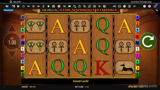 A 5-reel, 3-row slot game grid displaying Egyptian-themed symbols including ankh icons, a jackal, and letter tiles against a golden background.